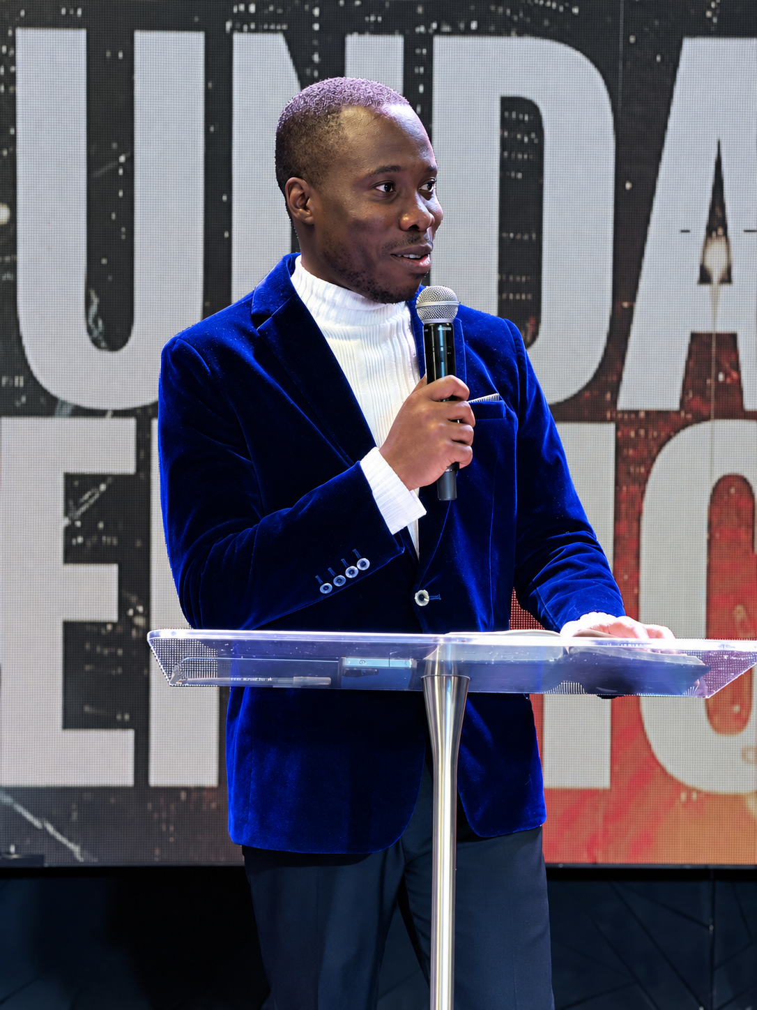 Ikhade Maro Igbape ministering at a lectern
