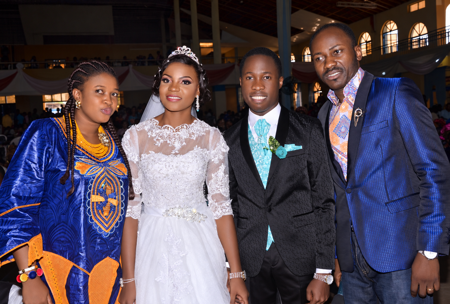 Maro and Mary Igbape on their wedding day with family